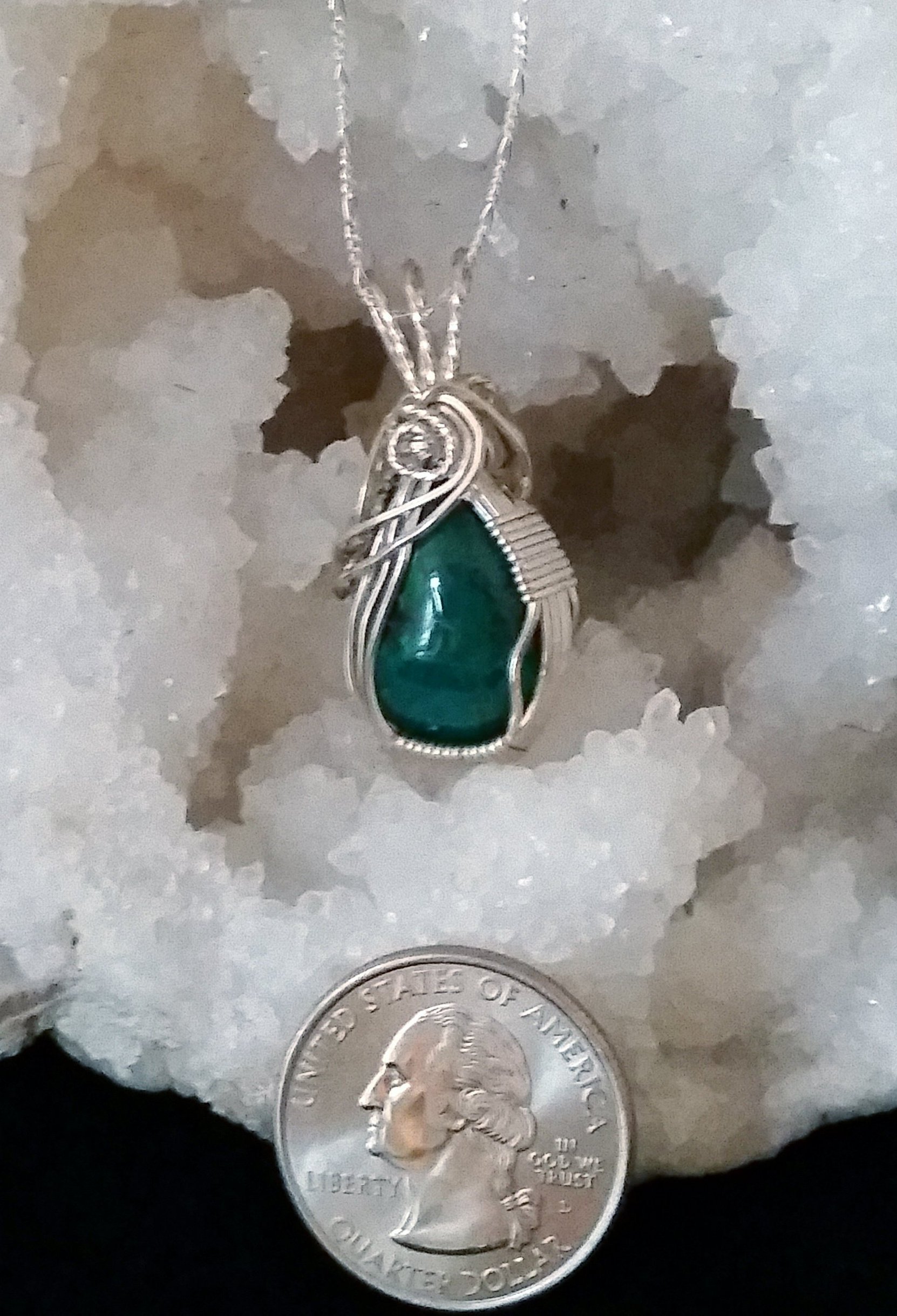 This beautiful Malachite-Chrysocolla pendant brings serenity, tranquility, and calming energies, making it a beautiful crystal to wear as a pendant. It brings the energy of new beginnings, helping to facilitate smooth transitions in times of change.